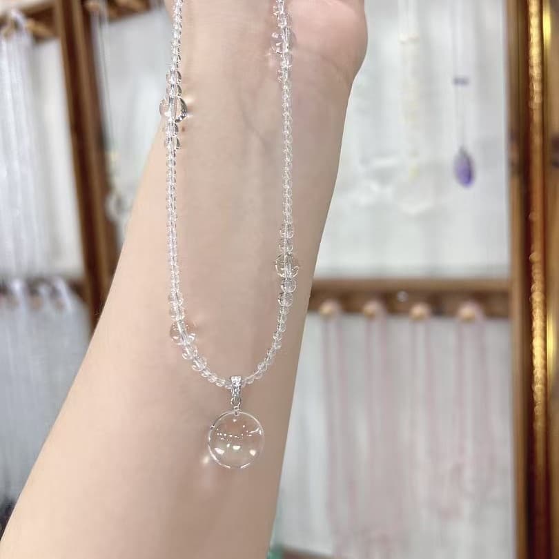 A luxurious, transparent, and uniquely designed white crystal dewdrop necklace White Crystal Dew Necklace, detail image 2